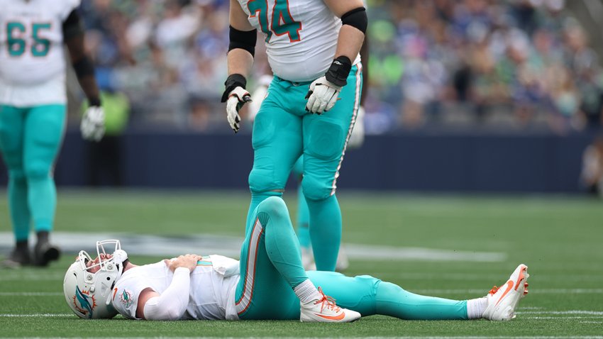 SEATTLE, WASHINGTON – SEPTEMBER 22: Liam Eichenberg #74 looks on as Skylar Thompson #19 of the Miami Dolphins lies on the ground injured during the third quarter at Lumen Field on September 22, 2024 in Seattle, Washington. (Photo by Steph Chambers/Getty Images)